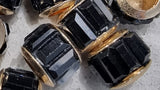 RONDELLES - 9-10.5MM FACETED GLASS - BRASS CORE - COLOUR - BLACK
