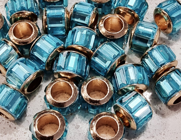 RONDELLES - 9-10.5MM FACETED GLASS - BRASS CORE - COLOUR - SKY BLUE
