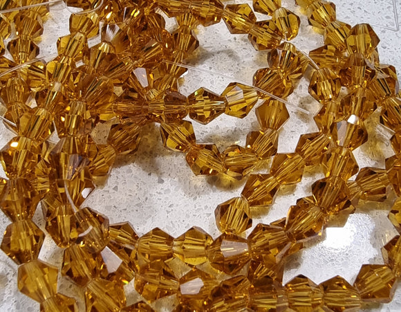 BICONES - 6MM GLASS FACETED BICONES - GOLDEN ROD