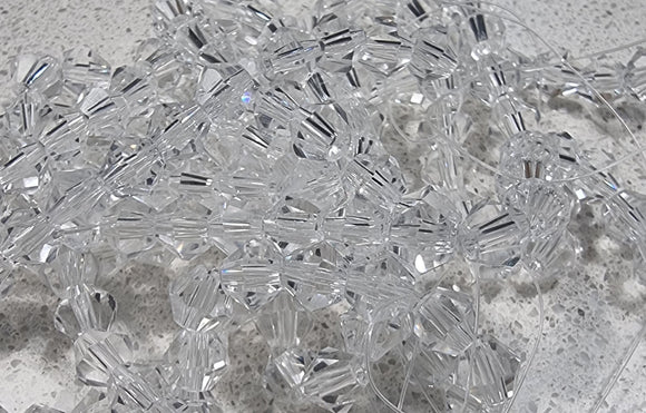 BICONES - 6MM GLASS FACETED BICONES - CLEAR