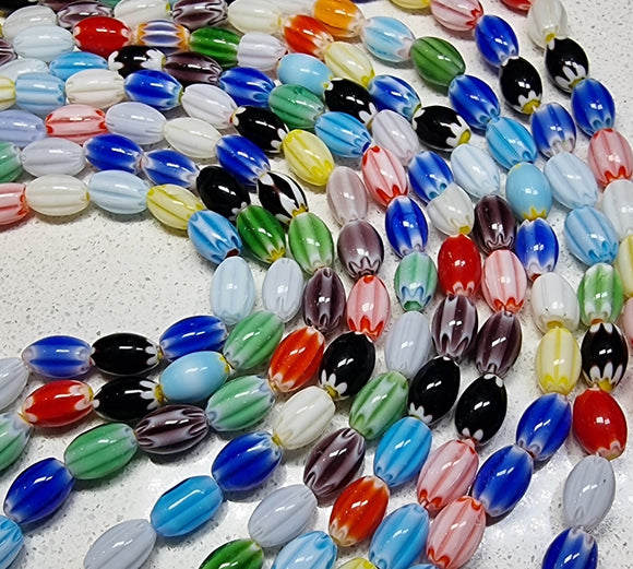 12 x 7.5MM OVAL MILLEFIORI GLASS BEADS - MIXED COLOUR STRAND
