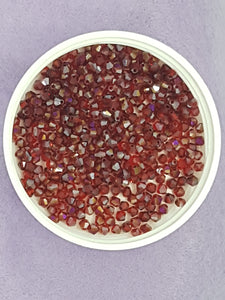 BICONES - 3MM GLASS FACETED ELECTROPLATED BEADS - HALF RED PLATED