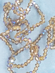 BICONES - 2MM GLASS FACETED ELECTROPLATED BEADS - Per Packet - DRK. GOLDEN ROD