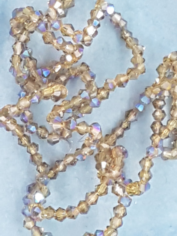 BICONES - 2MM GLASS FACETED ELECTROPLATED BEADS - Per Packet - DRK. GOLDEN ROD