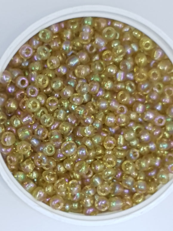 6/0 CHINESE ROUND SEED BEADS - TRANS. RAINBOW - PALE GOLDEN ROD