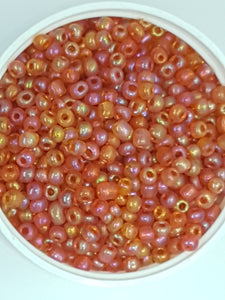 6/0 CHINESE ROUND SEED BEADS - TRANS. RAINBOW - ORANGE/RED