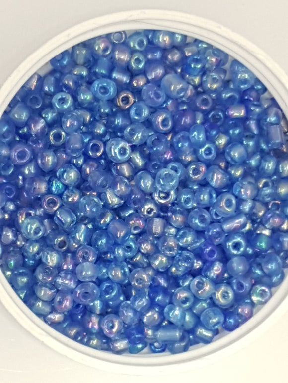 6/0 CHINESE ROUND SEED BEADS - TRANS. RAINBOW - CORNFLOWER BLUE