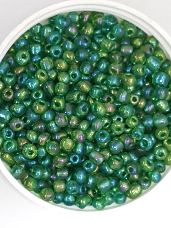 6/0 CHINESE ROUND SEED BEADS - TRANS. RAINBOW - DARK GREEN