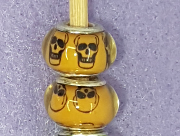 14MM LARGE HOLE ACRYLIC RONDELLES - BURNT ORANGE WITH SKULLS