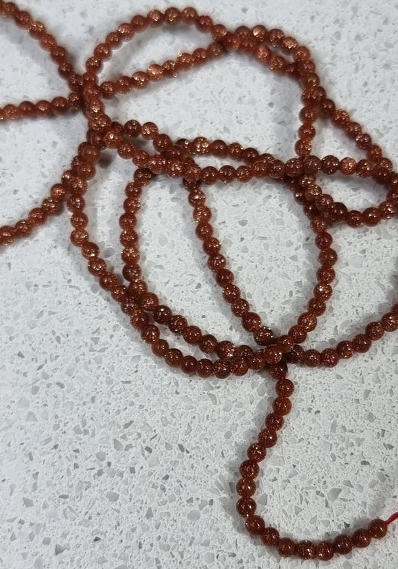 GEMSTONE STRAND - 2MM SYNTHETIC GOLDSTONE BEADS
