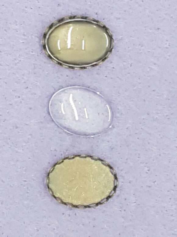 CABOCHON - 18 X 13MM DOMED GLASS TRANS. OVAL COPPER SETTING